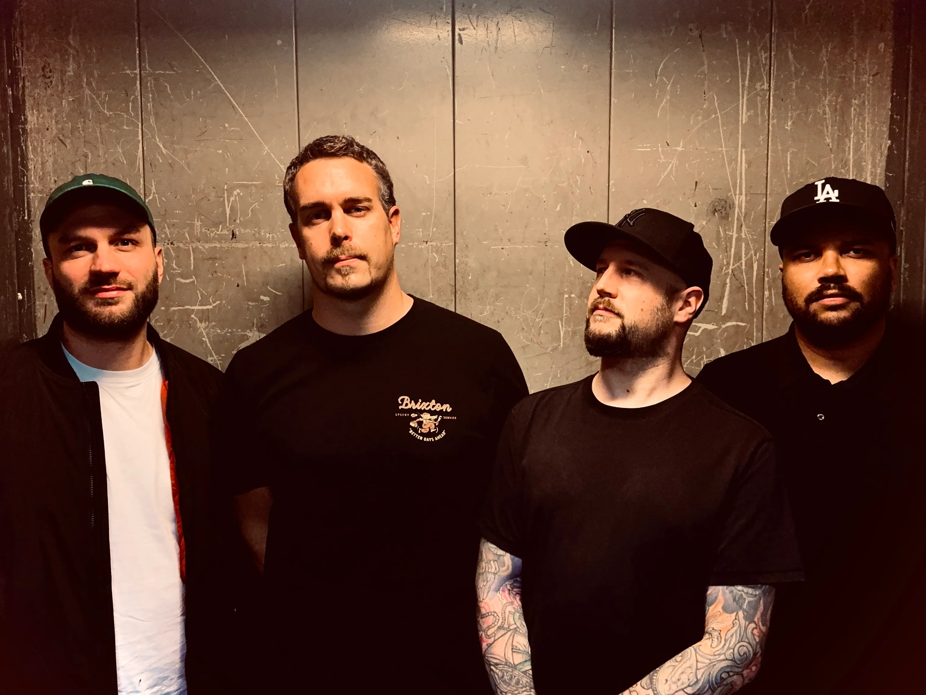 Tell All Your Friends band members performing on stage